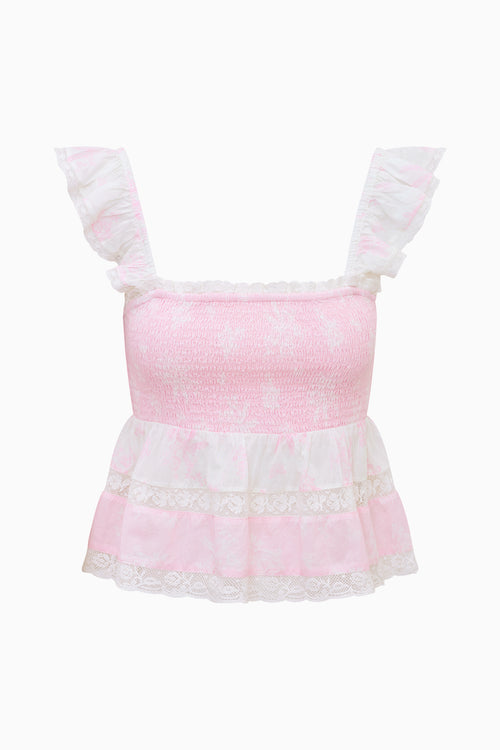 Pink top with white lace details on a white background