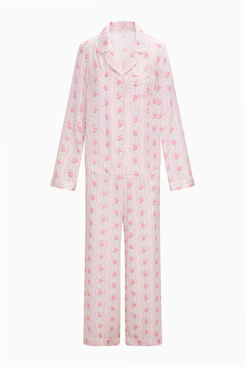 Pink floral pajama set on a white background