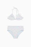 White bikini set with small red flowers on a white background