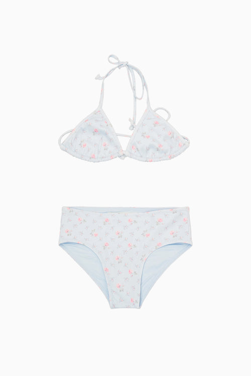 White bikini set with small red flowers on a white background