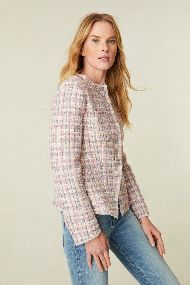 itted jacket has a center front opening with self-covered, functional buttons, patch pockets on the chest, self-frayed fringe with a zig-zag stitch, and chiffon underneath the fray. The silhouette is shaped in the front with a small break at the center front closure outlining a slight, gentle curve with a button closure.