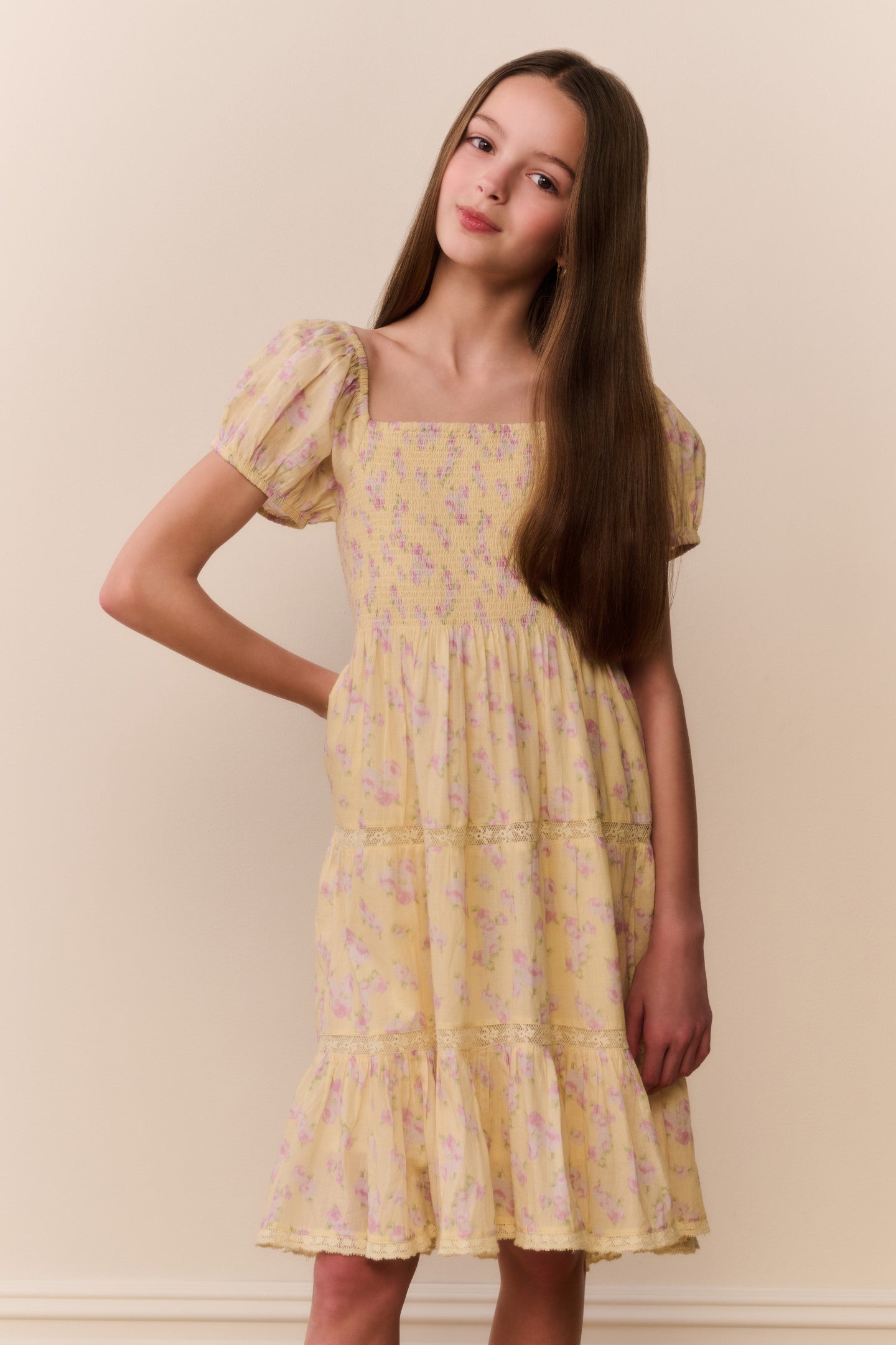 Women sitting in grass field wearing LoveShackFancy Slip Dresses