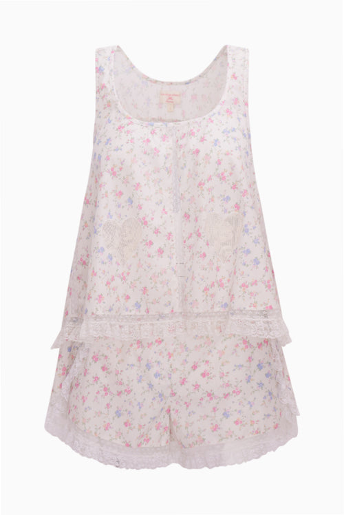 Floral-patterned sleeveless top and shorts pajama set on a white background