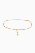 Gold chain belt with a small heart charm on a white background