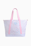 Tote bag with pink straps and a floral design on a white background