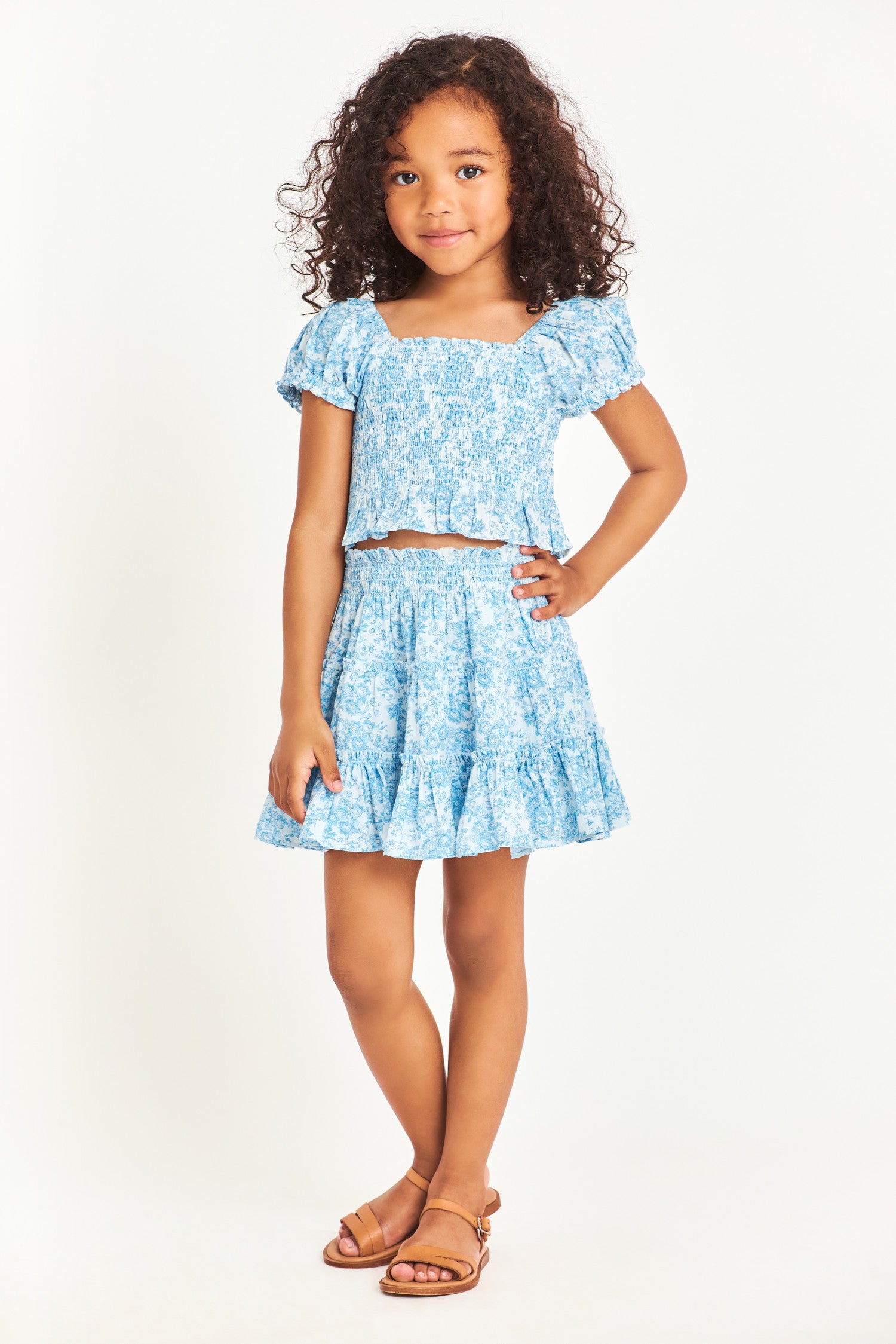 Model wearing kids blue mini skirt