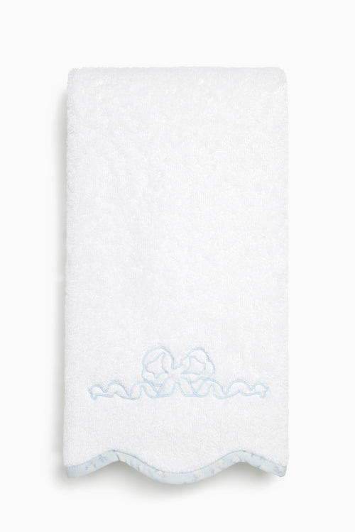 White towel with blue embroidery on a white background