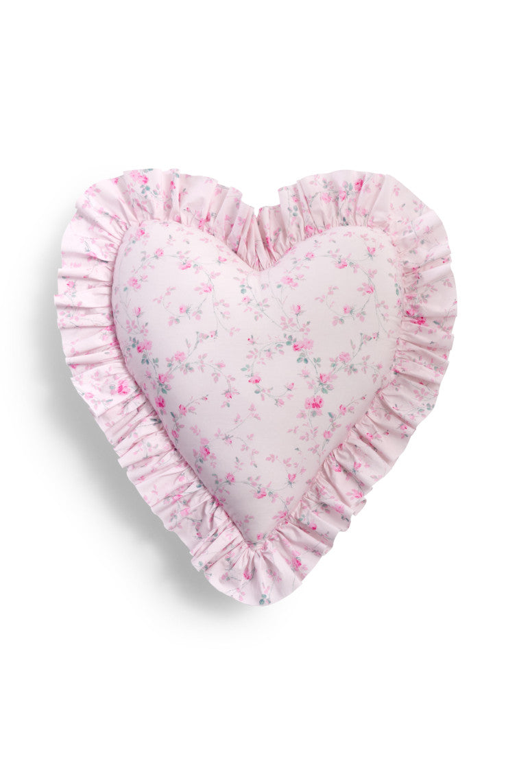 Floral printed heart shape pillow featuring ruffles on each end, a removable insert, and zipper closure.