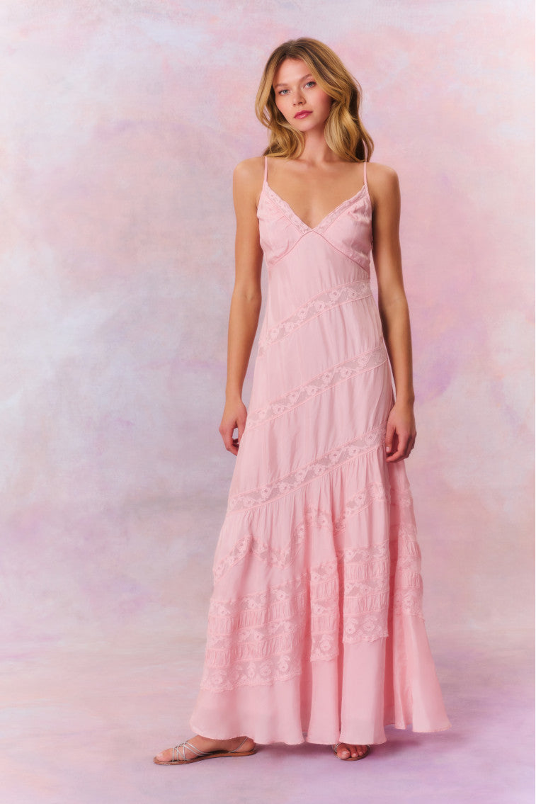 Maxi dress featuring a custom lace throughout and a beautiful V-neck line. 