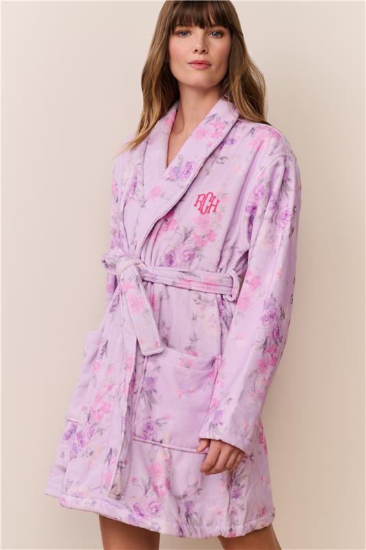 Women sitting in grass field wearing LoveShackFancy Slip Dresses