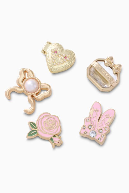 Set of decorative charms with heart, rose, and rabbit designs on a white background