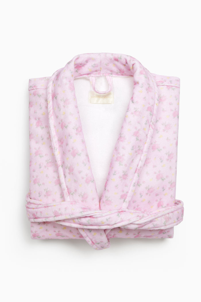 Woman wearing a pink robe and headband with a subtle pattern on a beige background - Customized