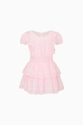 Pink dress with ruffled layers on a white background