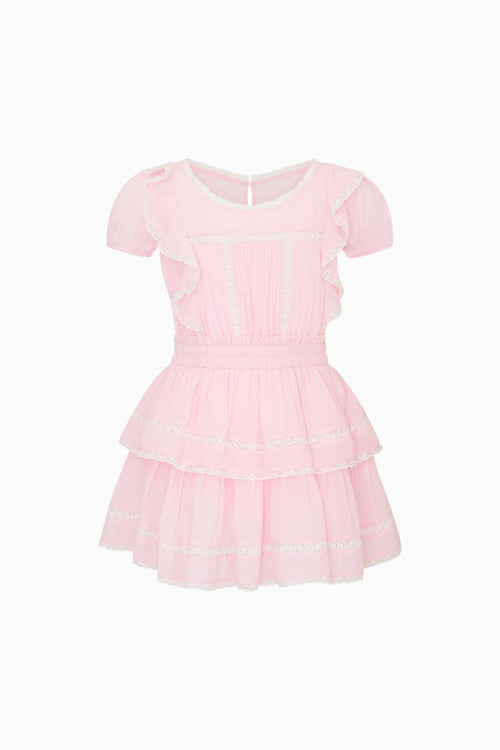 Pink dress with ruffled layers on a white background