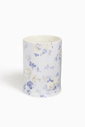 Ceramic cup with floral pattern on a white background
