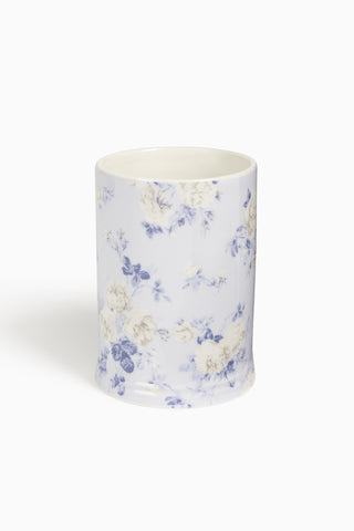 Ceramic cup with floral pattern on a white background