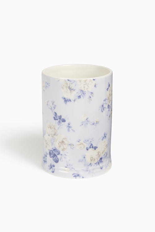 Ceramic cup with floral pattern on a white background
