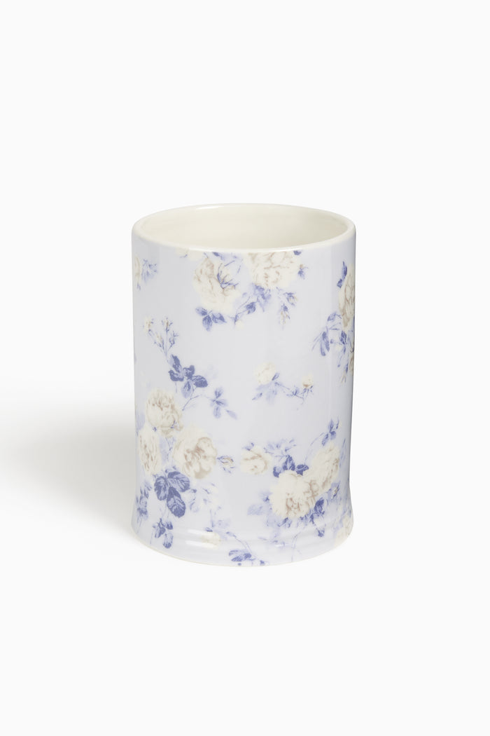 Ceramic cup with floral pattern on a white background