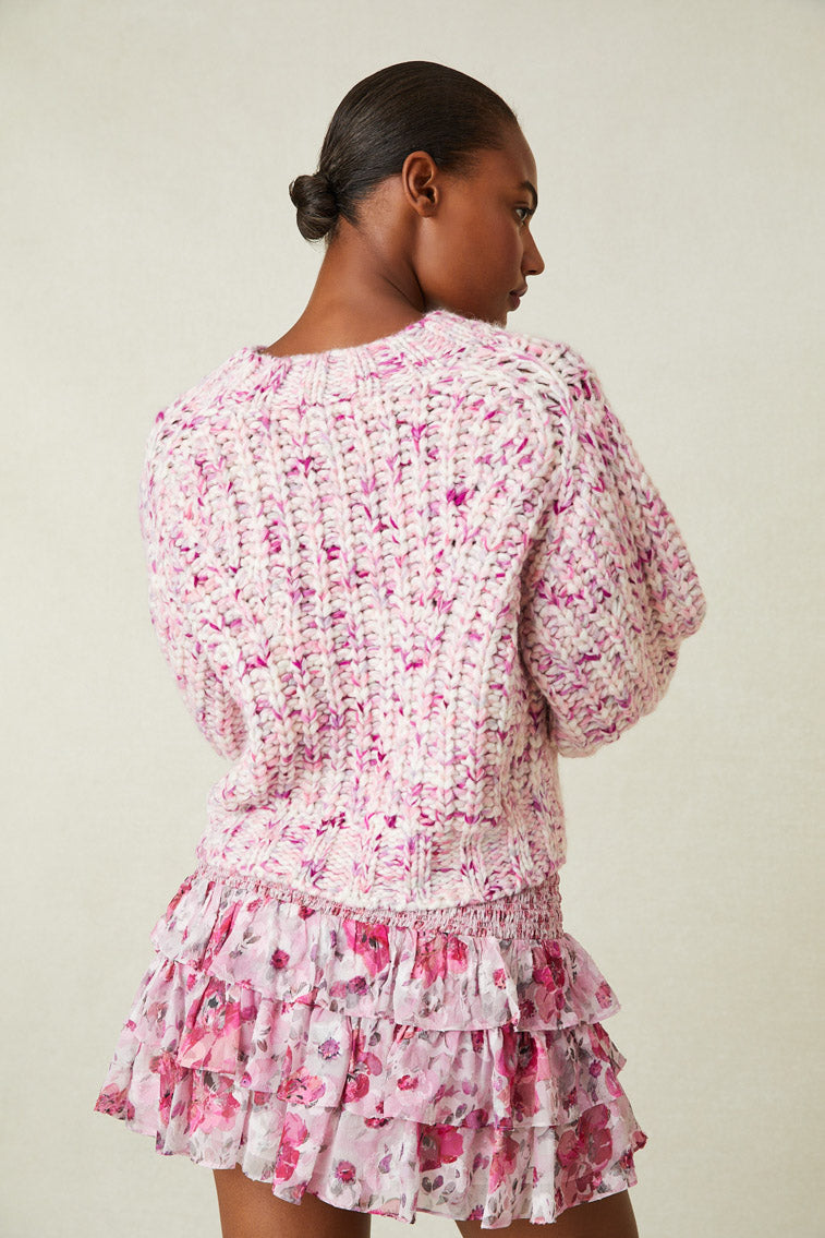 Back image of model wearing multi-tone pink knit sweater