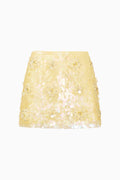 Yellow sequin skirt on a white background