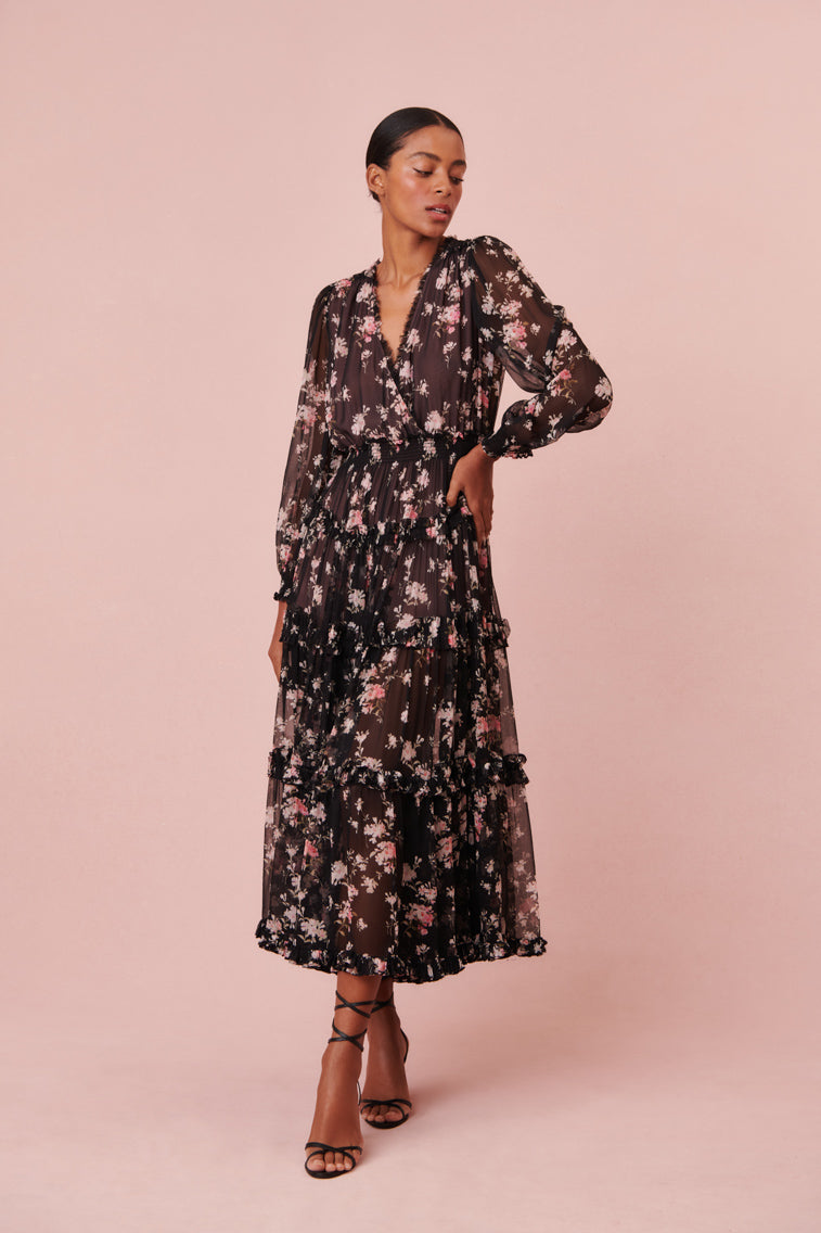 Maxi dress with long blouson sleeves, a v-neck, and shirred tiers at the skirt