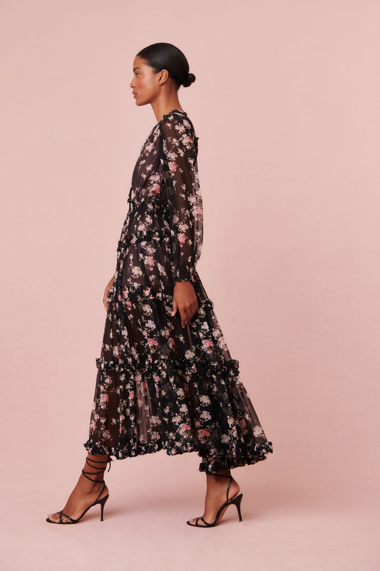 Maxi dress with long blouson sleeves, a v-neck, and shirred tiers at the skirt