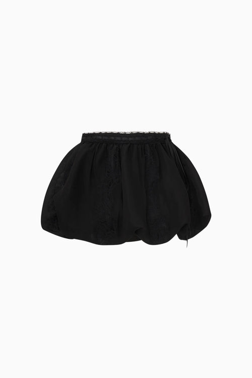 Black skirt with lace trim on a white background