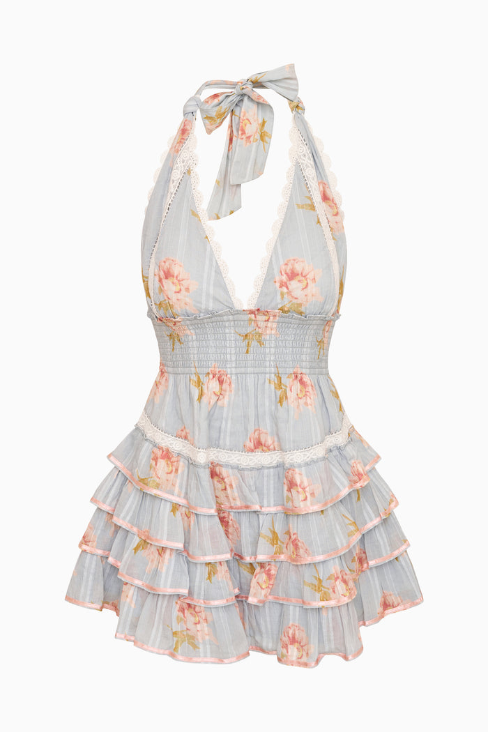 Floral dress with ruffled layers on a white background