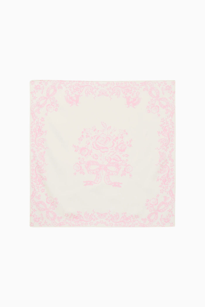 Pink and white patterned square scarf on a white background
