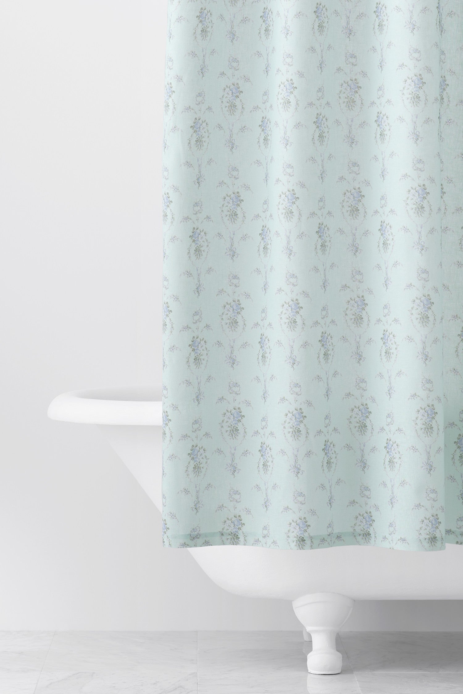 Designed from linen and cotton, its the perfect vintage-inspired shower curtain featuring a blue floral print across the back of a baby blue shower curtain. 