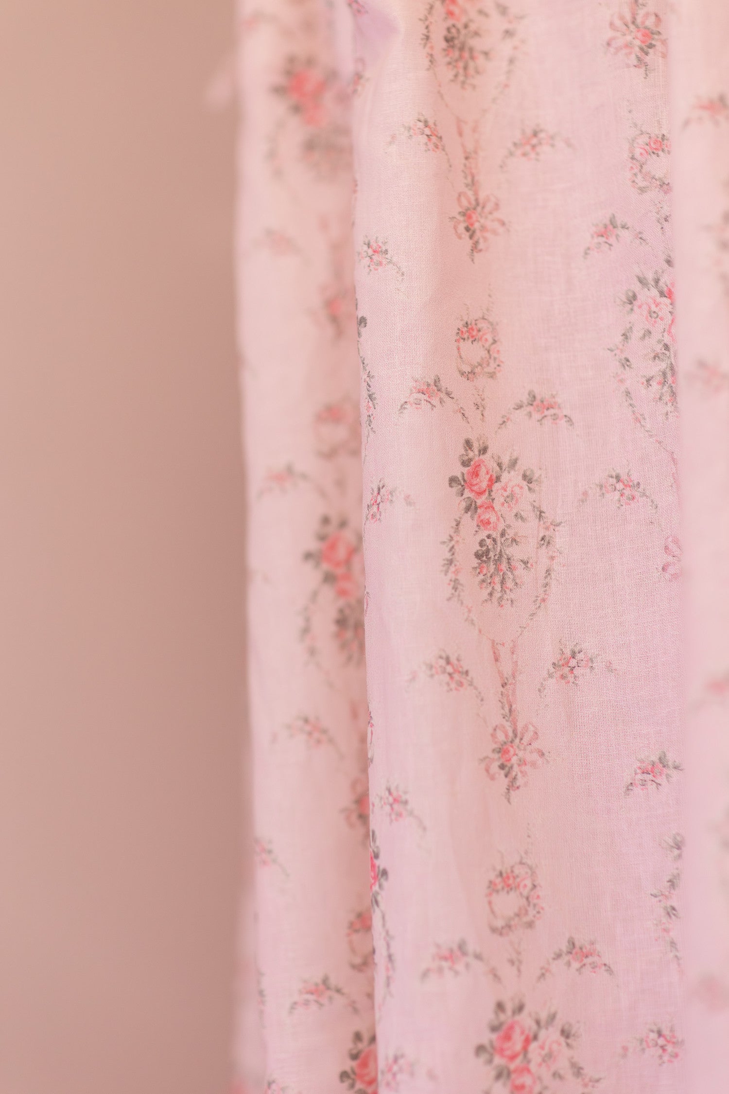 Designed from linen and cotton, its the perfect vintage-inspired shower curtain featuring a pink floral print across the back of a baby pink shower curtain. 