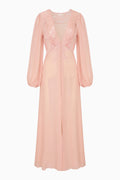 Pink long sleeve evening gown with lace detailing on a white background