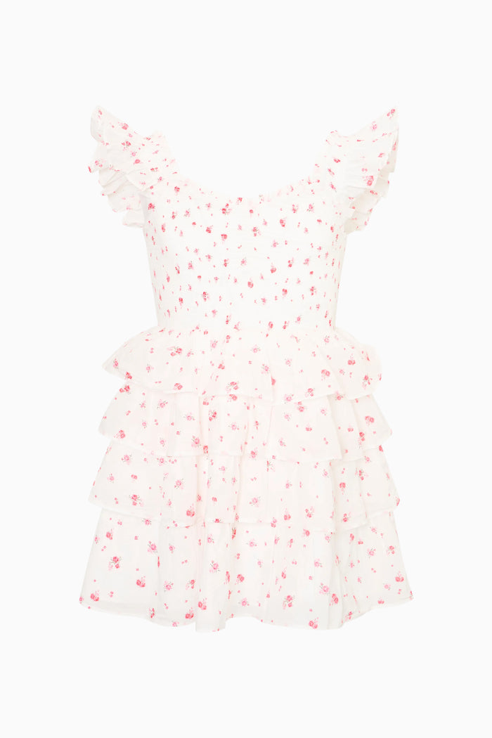 White dress with red floral pattern on a white background