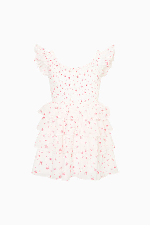 White dress with red floral pattern on a white background