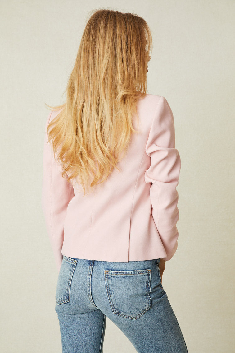 Back image of model wearing pink double breasted blazer