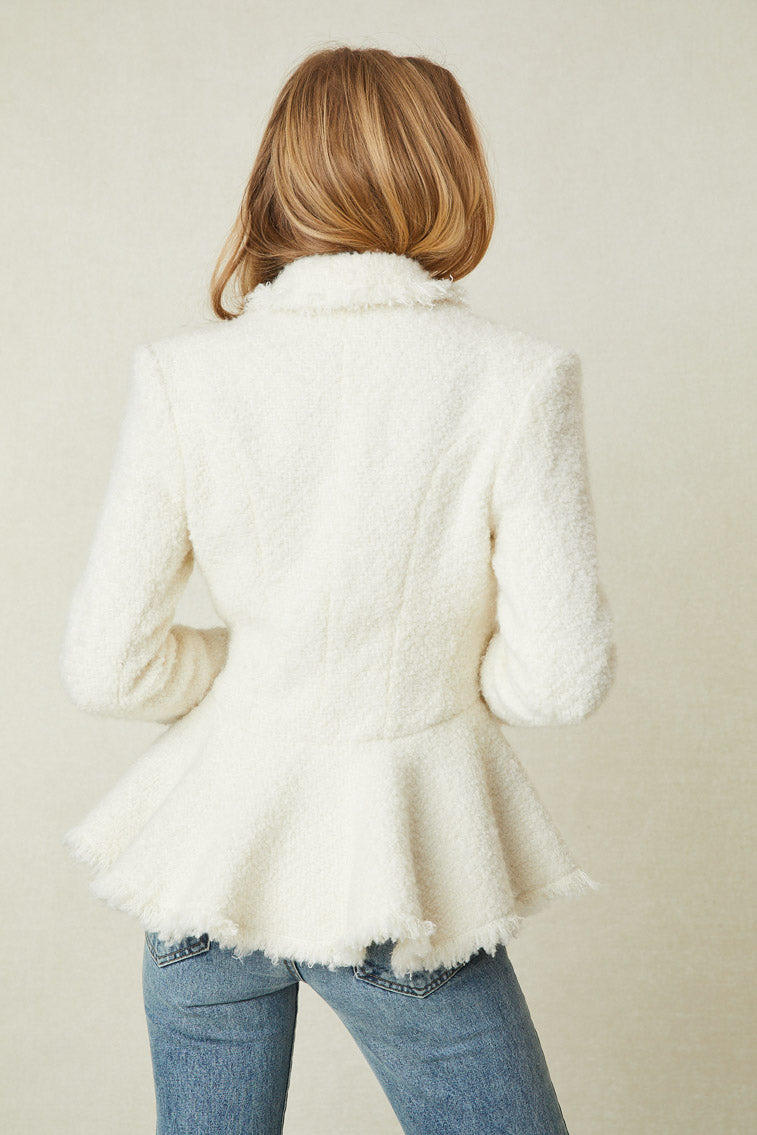 Back image of model wearing white jacket with buttons down front and peplum bottom.