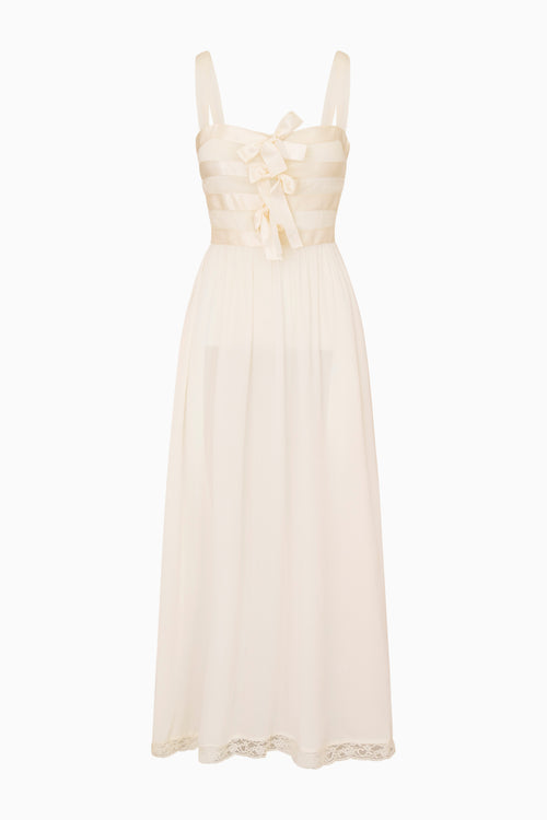 Beige dress with bow detail on a white background