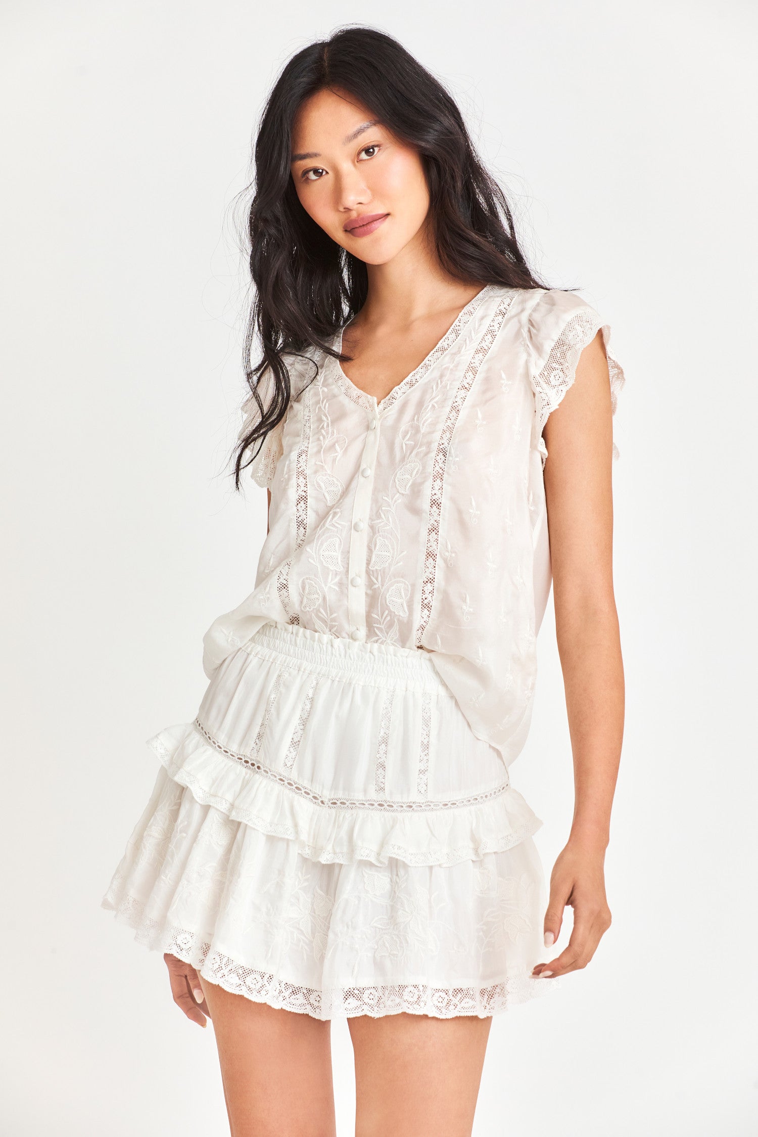Model wearing Tanisha Mini Skirt in Antique White