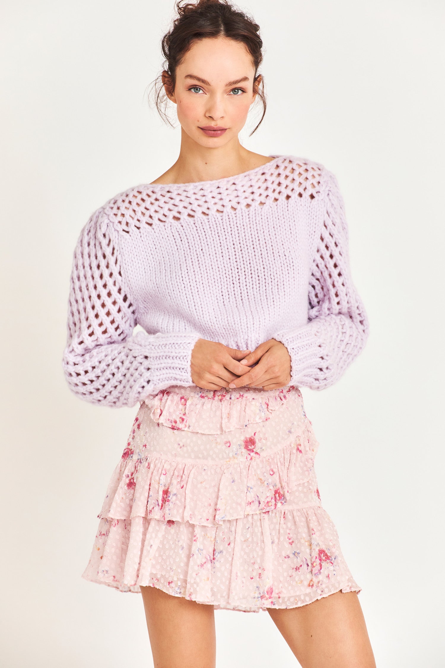 Model wearing pink mini skirt