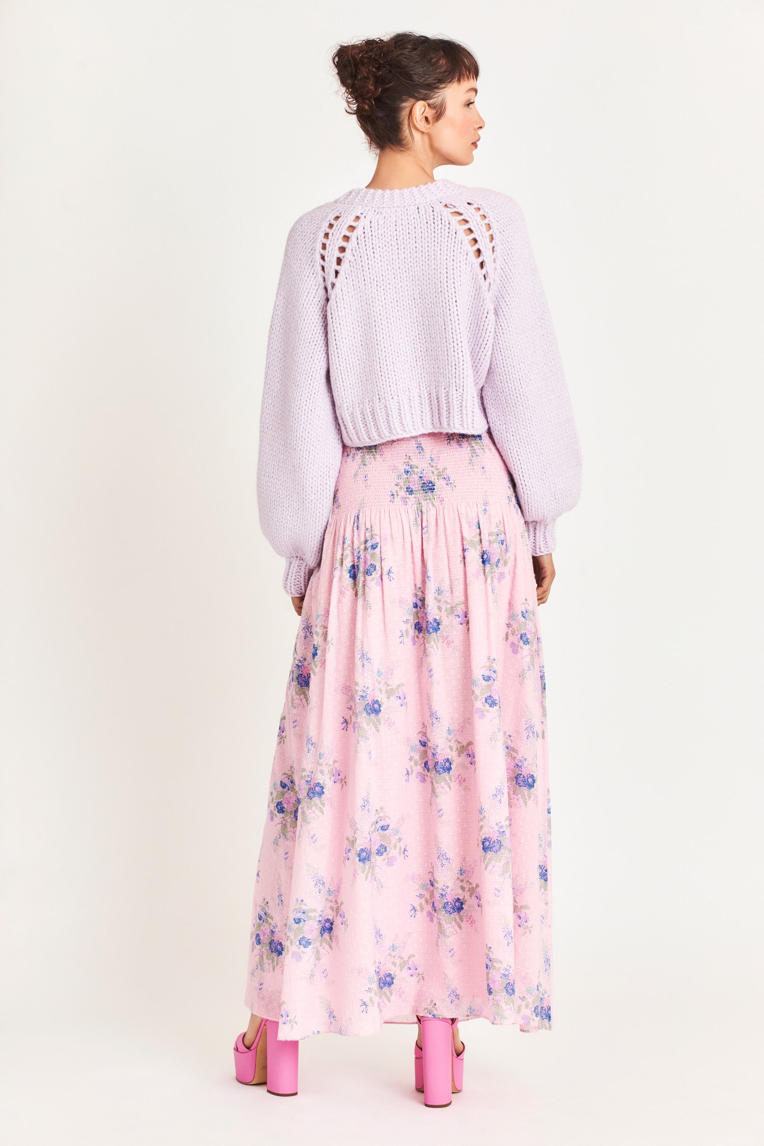 Falune Maxi skirt features an heirloom bouquet on a soft, textured pink dot fabric. It has a smocked hip yoke and an added sleep for sexiness. 