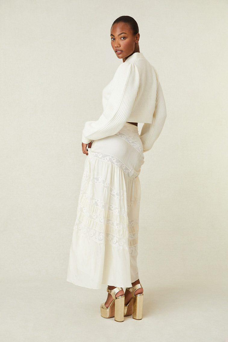 Back image of model wearing white silk maxi skirt with lace panels