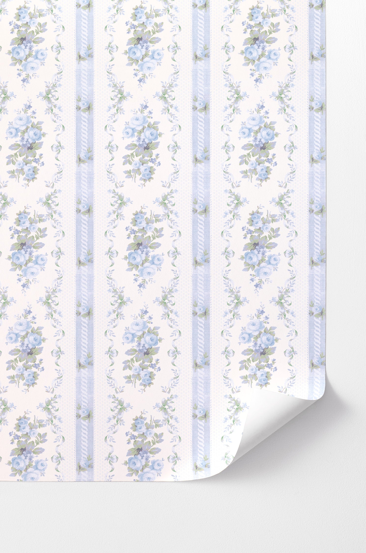 This design showcases beautiful baby blue floral prints delicately scattered across a pristine white backdrop. Adding to its visual appeal, a subtle blue strip elegantly separates the floral patterns, creating a sense of depth and space.