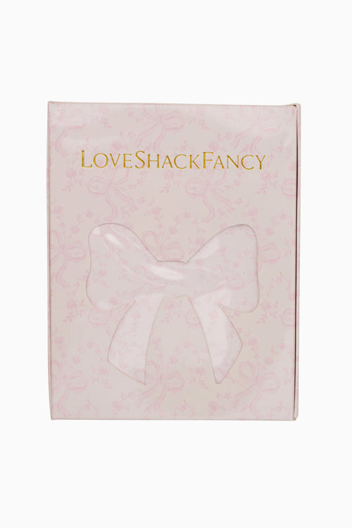 Pink box with a bow and 'Love Shack Fancy' branding on a white background