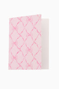 Pink and white patterned fabric on a white background