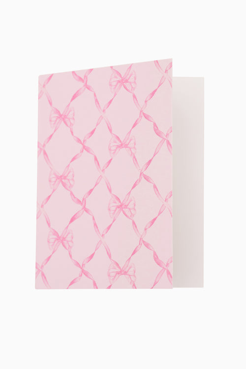 Pink and white patterned fabric on a white background