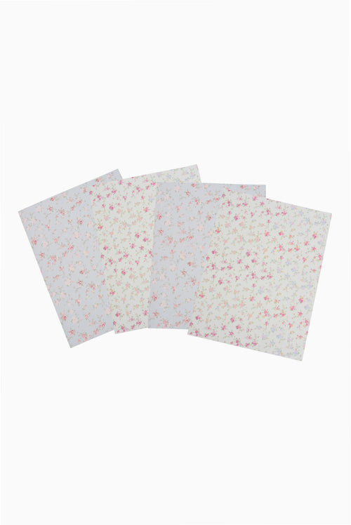 Four of floral-patterned folders on a white background