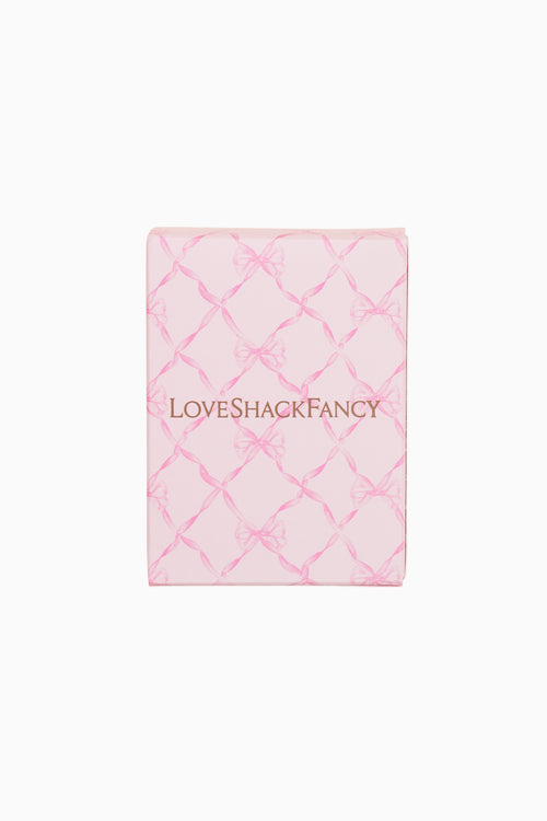 Pink quilted product with 'LOVE SHACK FANCY' branding on a white background