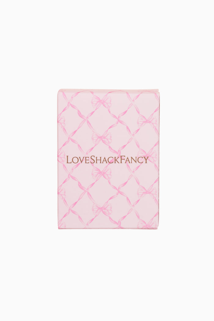 Pink quilted product with 'LOVE SHACK FANCY' branding on a white background