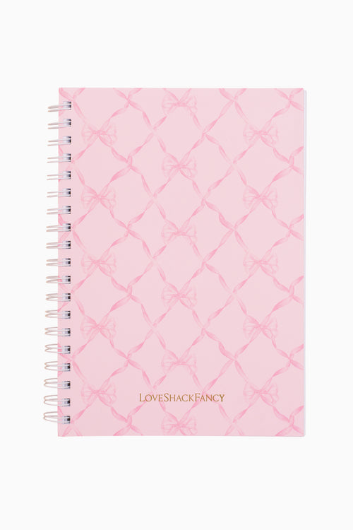 Pink quilted notebook with 'LOVE SHACK FANCY' branding on a white background