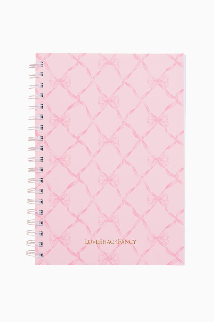 Pink quilted notebook with 'LOVE SHACK FANCY' branding on a white background